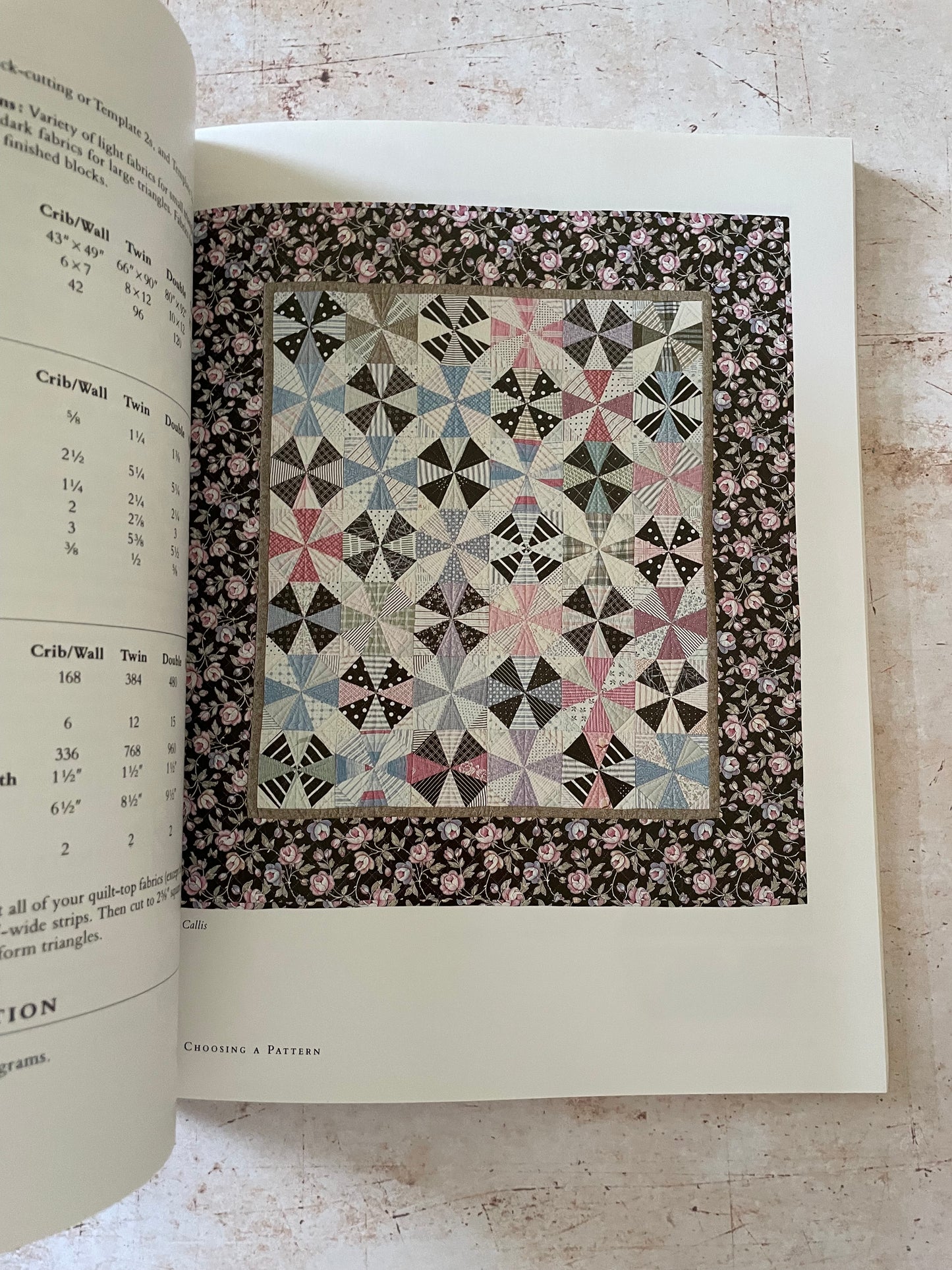 a pink and blue pinwheel star quilt