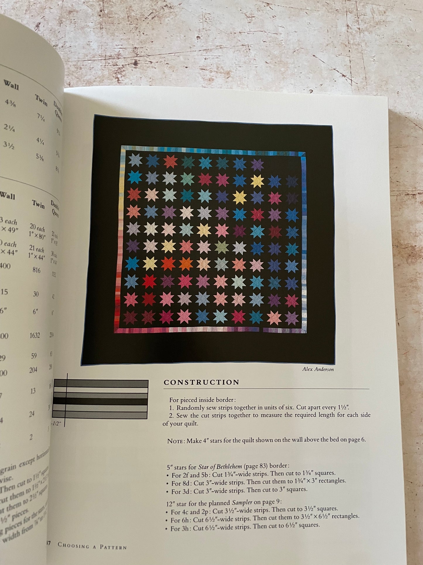 rainbow star quilt on a black fabric background