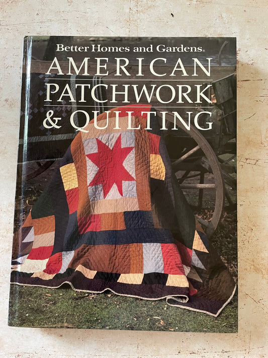 a book cover with a quilt with a red star