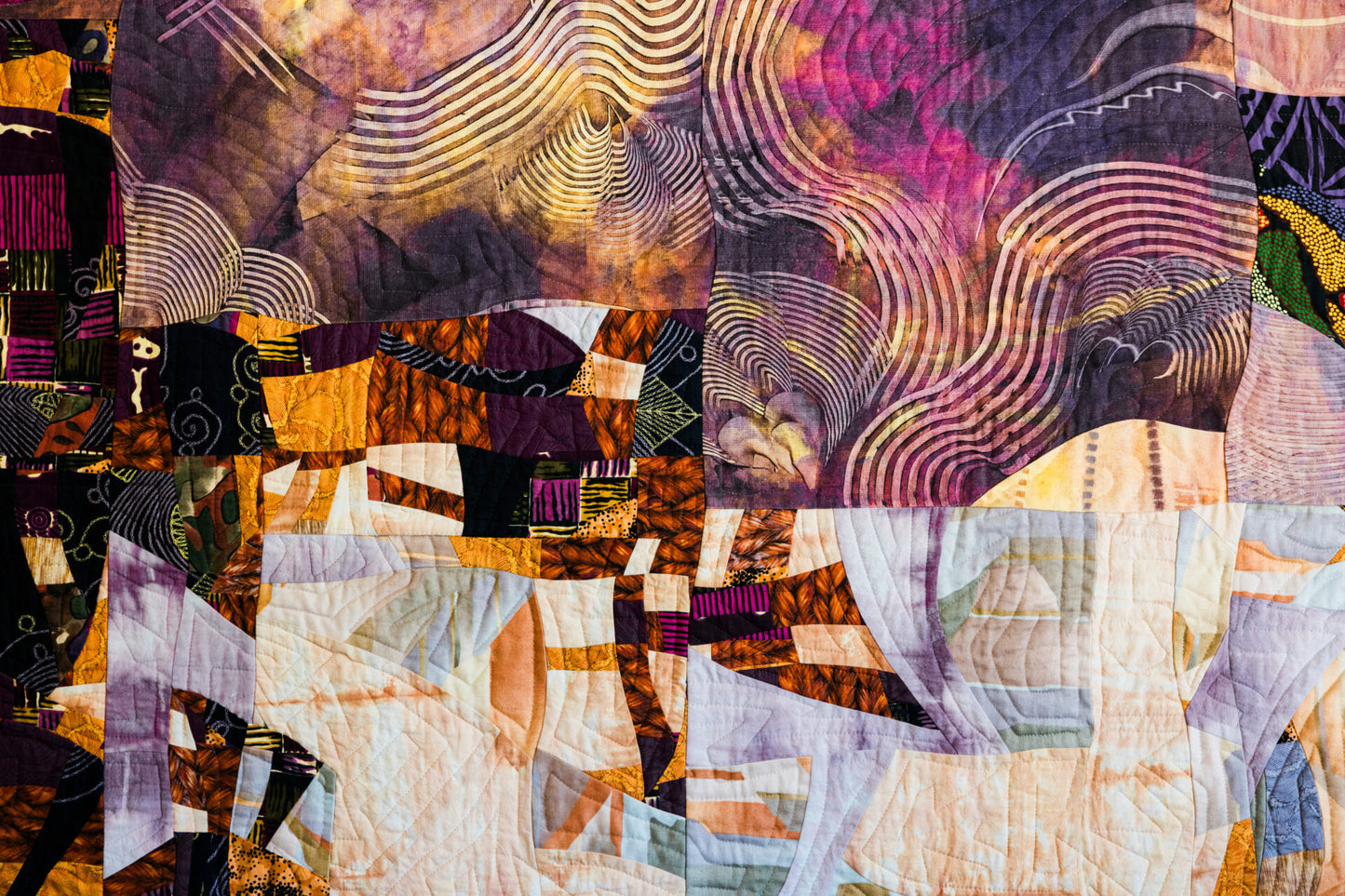 Colorful abstract quilt with geometric patterns