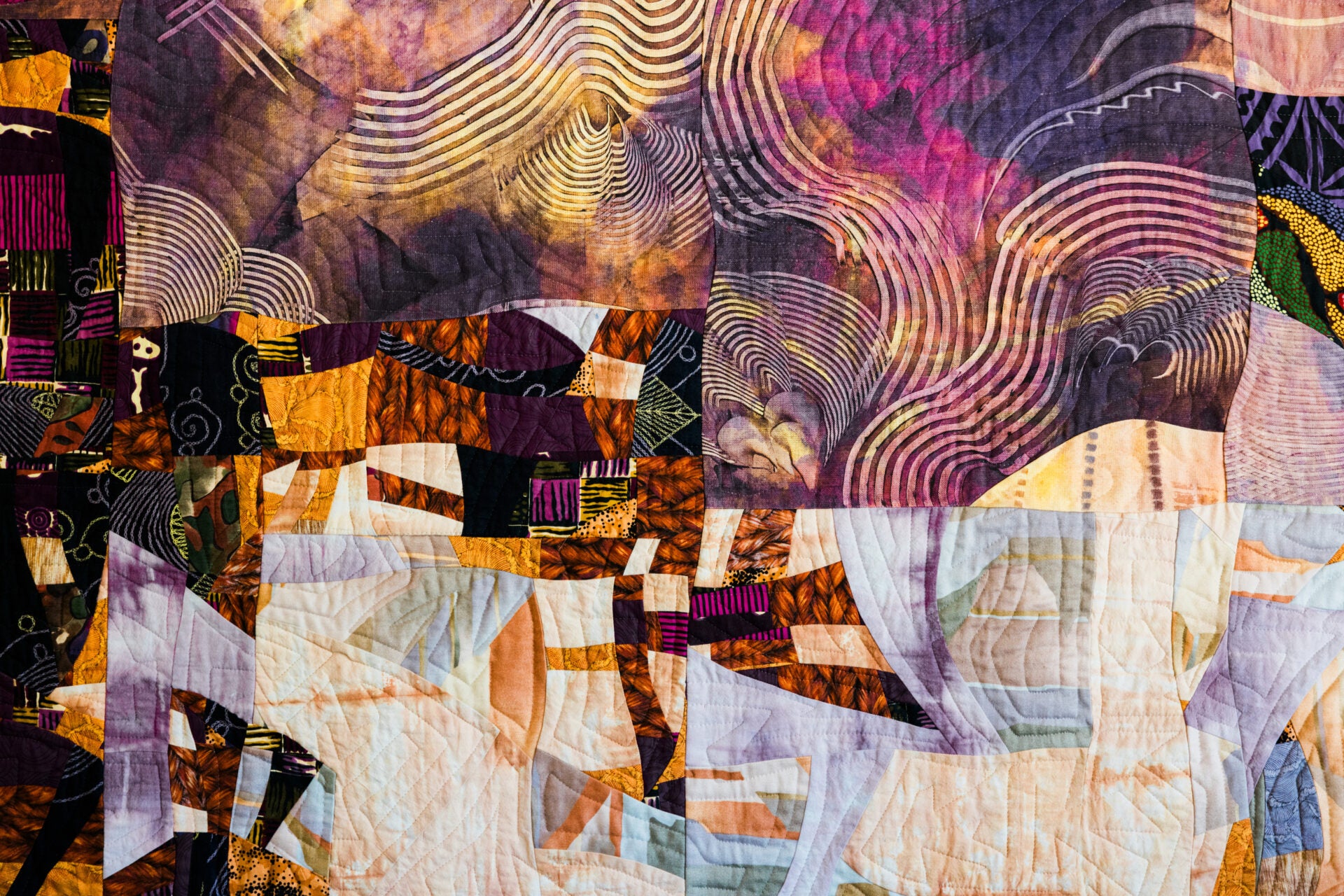 Colorful abstract quilt with geometric patterns