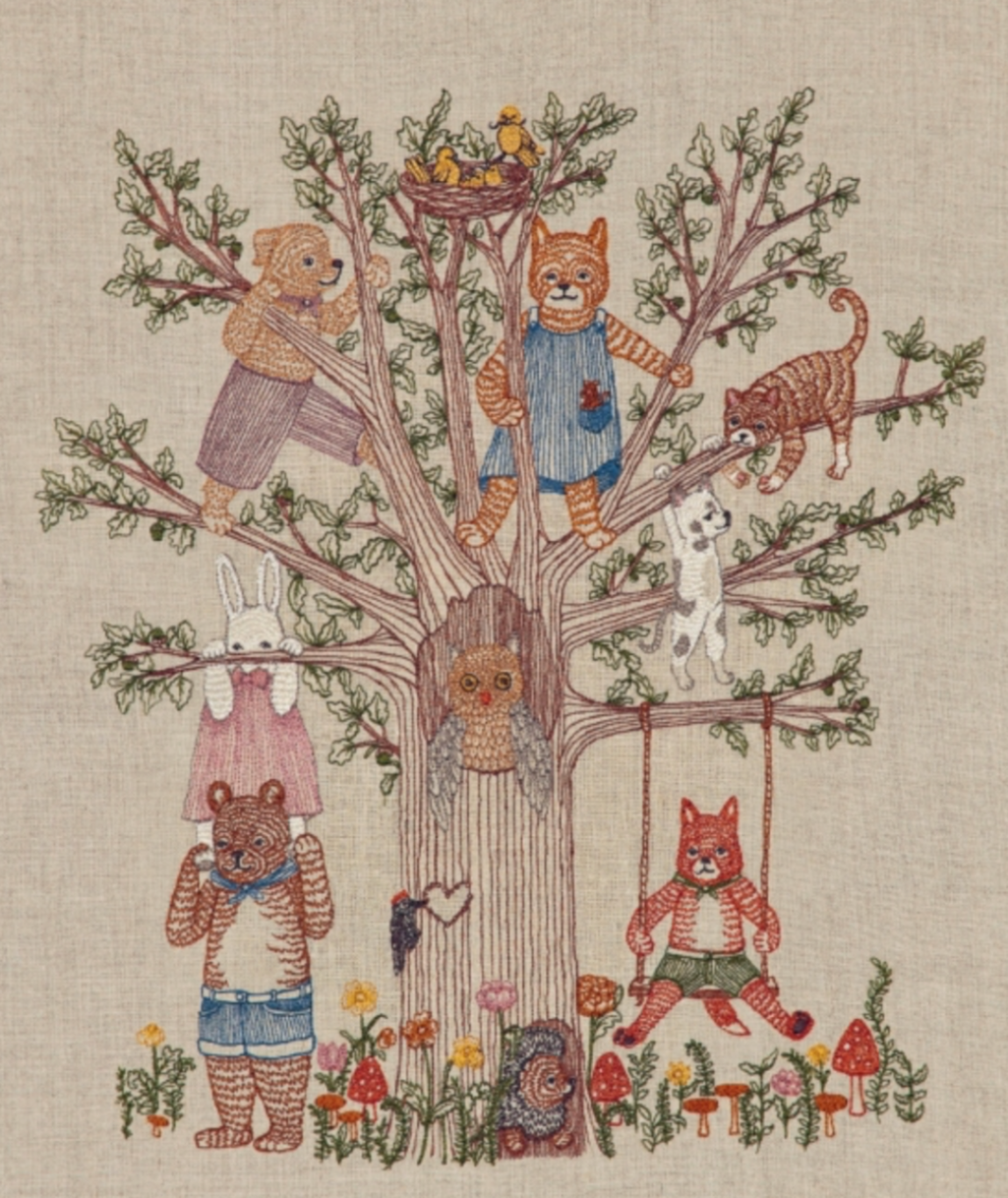 Embroidered animals in a tree