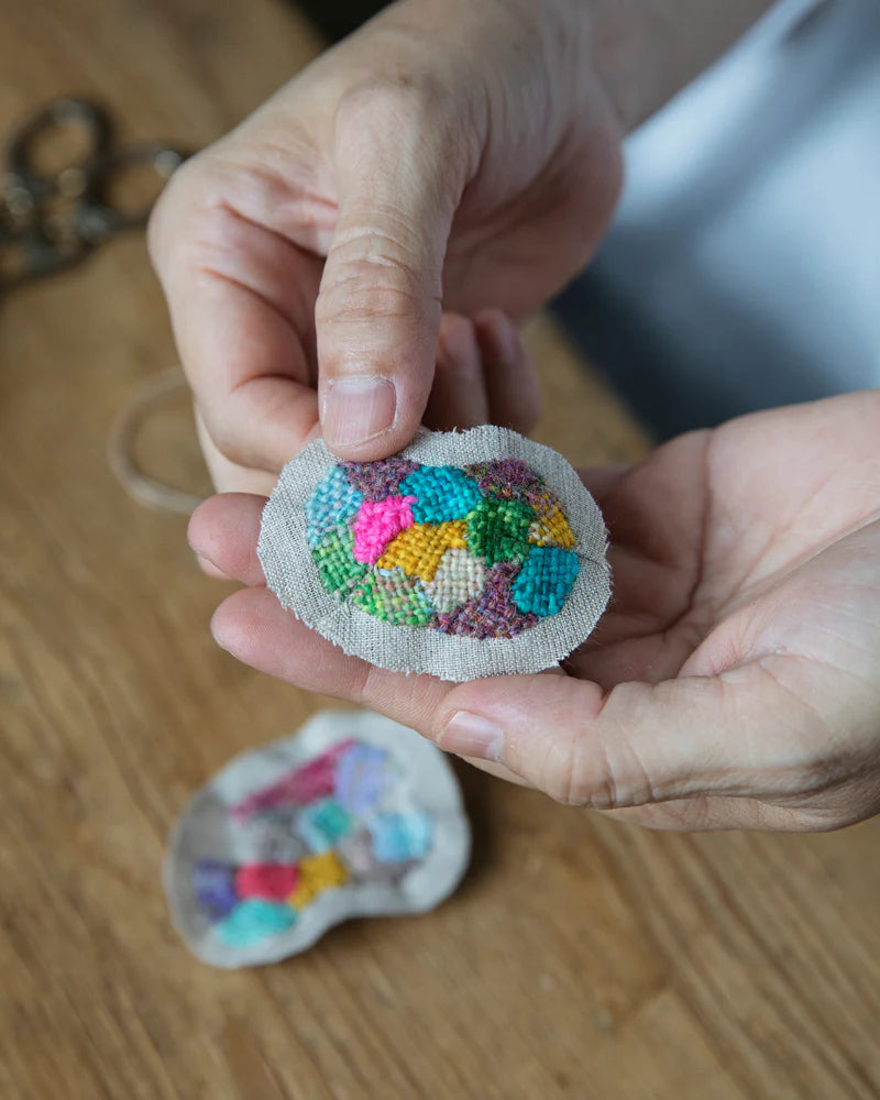 a colorful embroidered circle