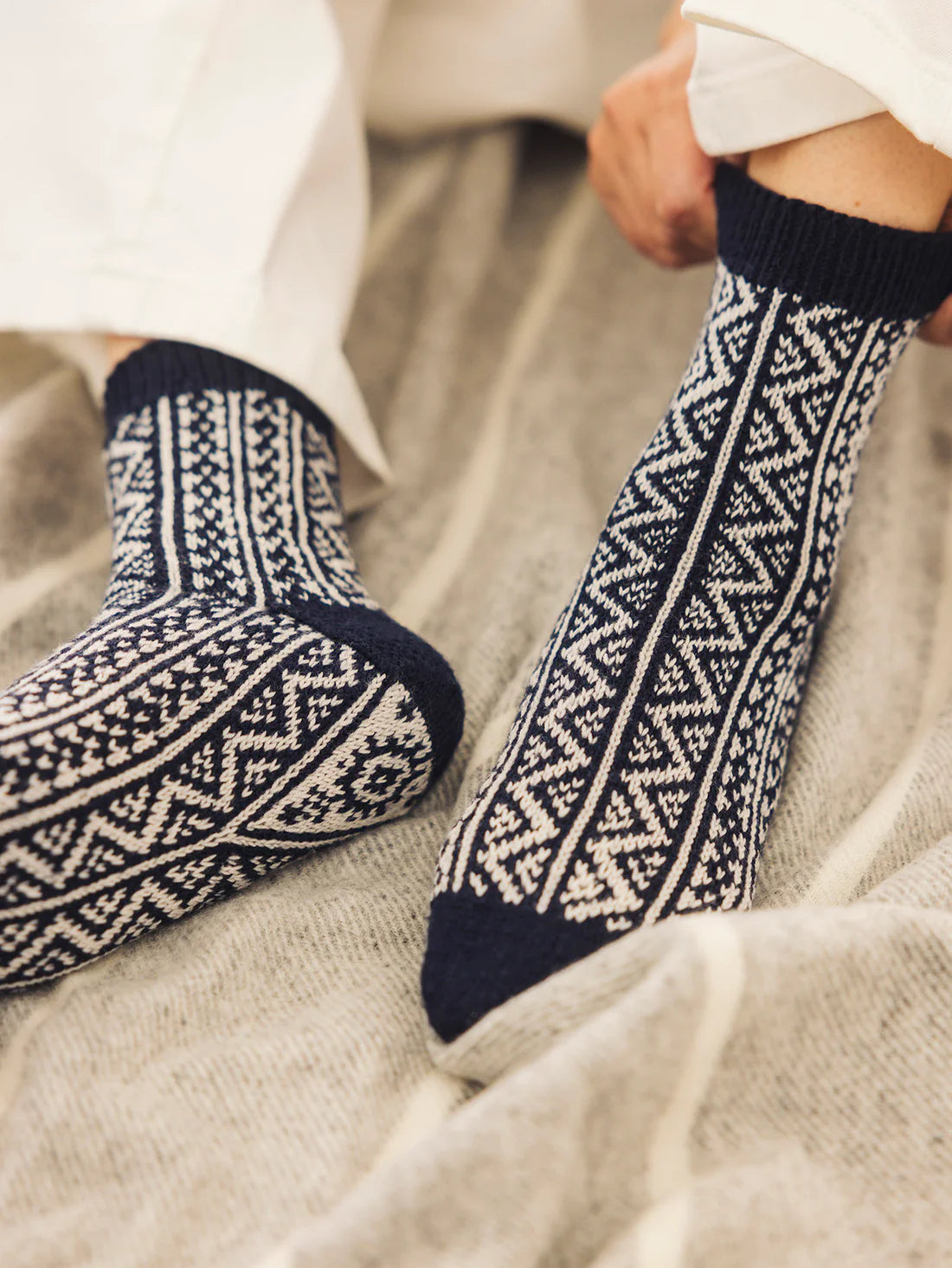 a pair of black and white patterned socks