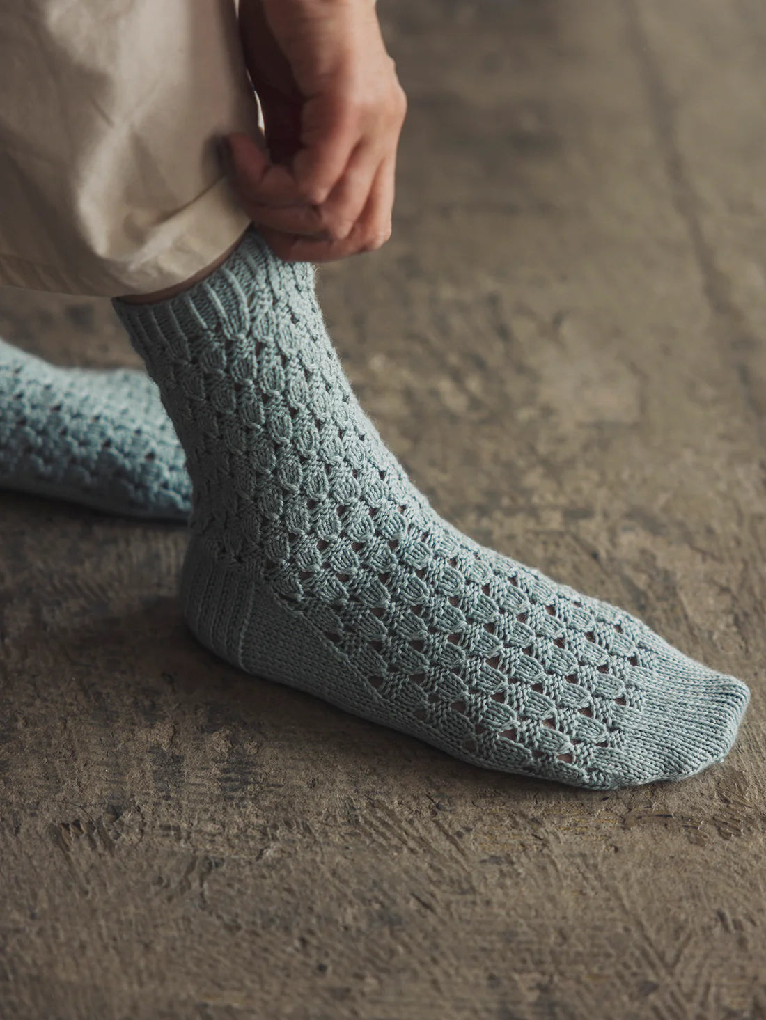a pair of light blue lace detail socks