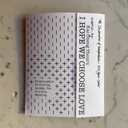 Booklet with text and patterns on a textured surface
