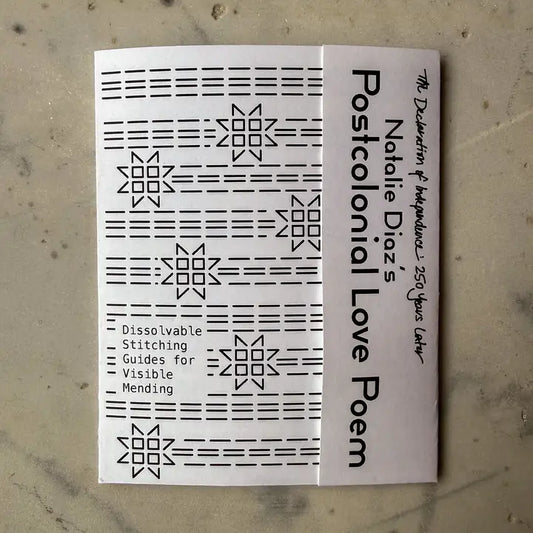Booklet with text and patterns on a textured surface