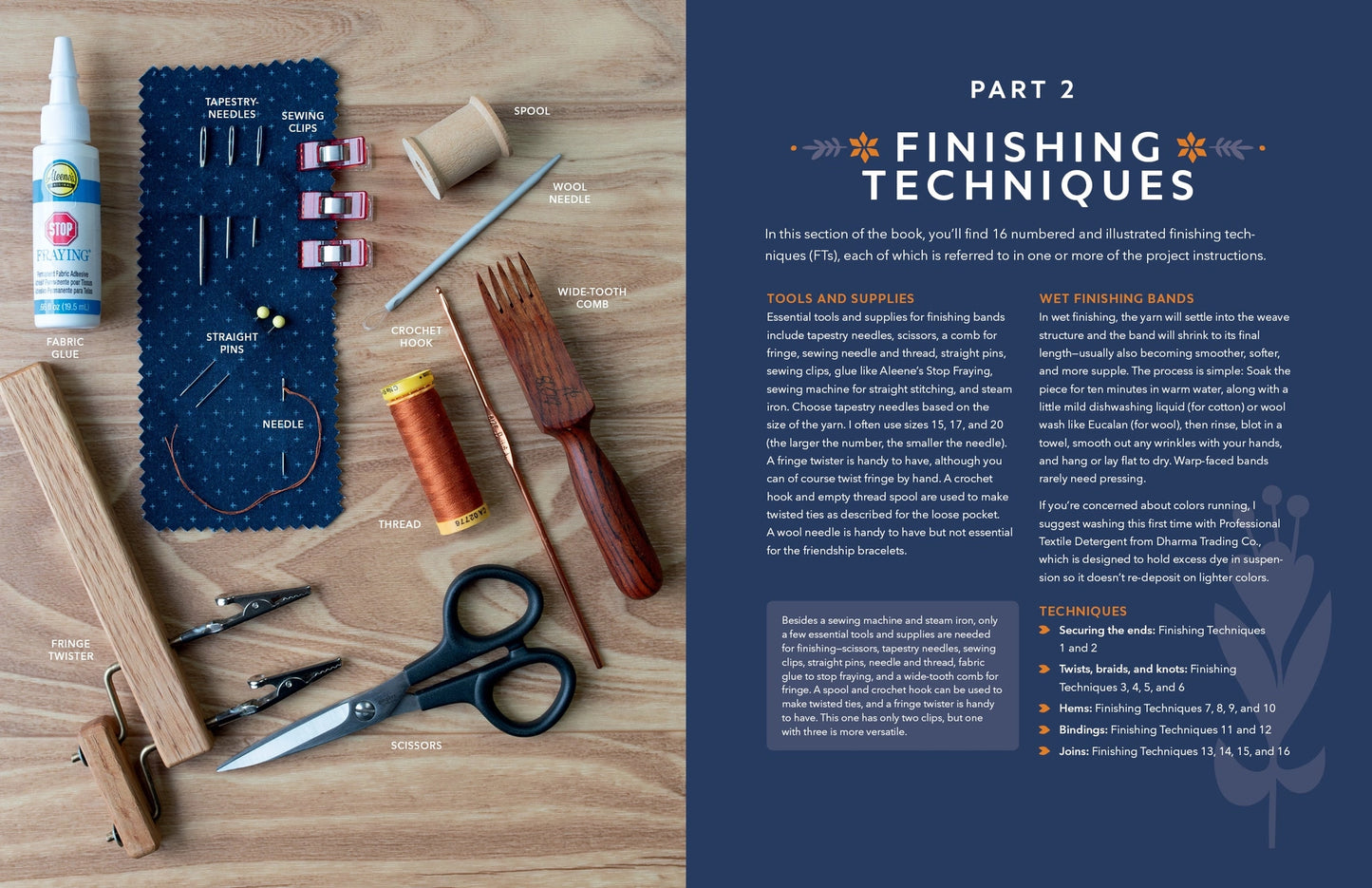 An open bookshowing a finishing kit laid out on a wood surface beside printed text. Visible items include a spray bottle, fabric scissors, wooden tools, a spool of thread, needles, pins, and a dark blue needle card.