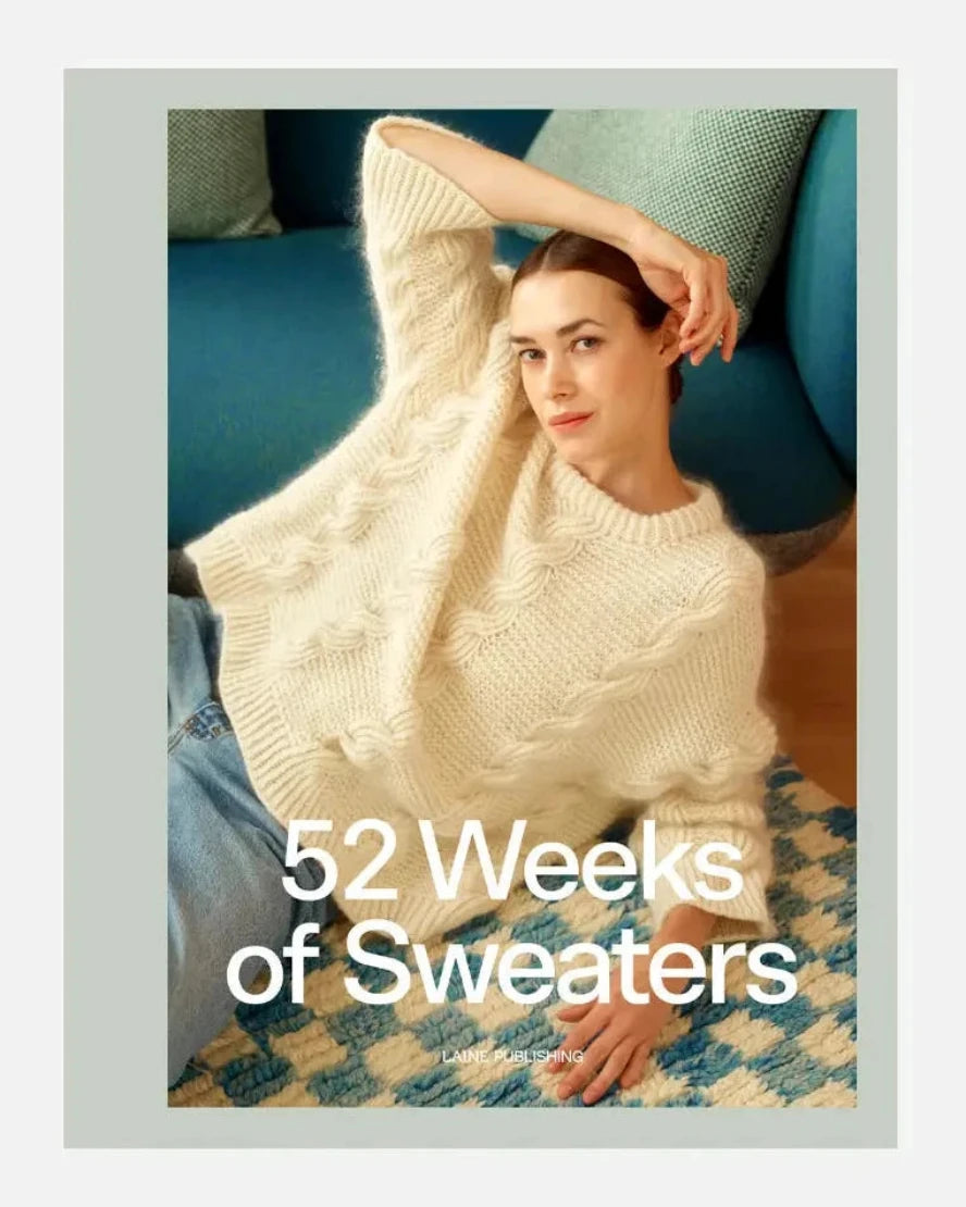 Woman wearing a white sweater with '52 Weeks of Sweaters' text overlay.