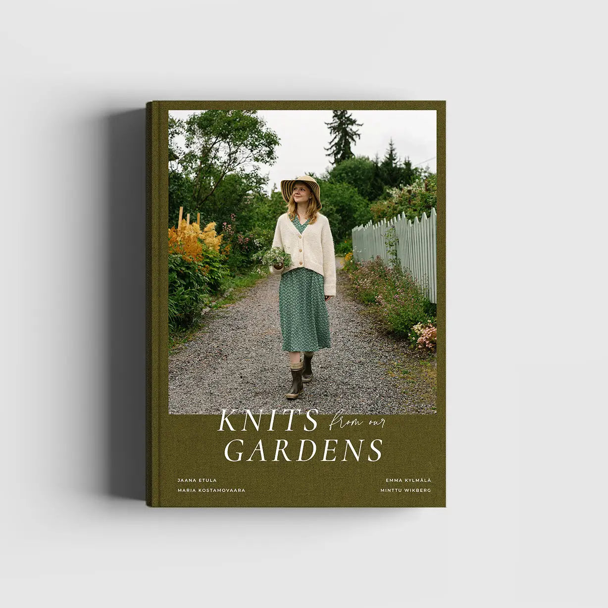 Book cover of 'Knits from our Gardens' with a woman walking in a garden.
