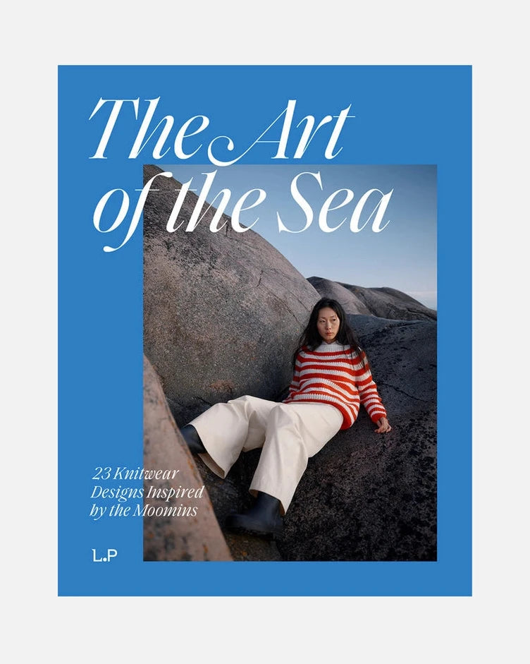 Book cover of 'The Art of the Sea' with a person sitting on rocks by the sea.