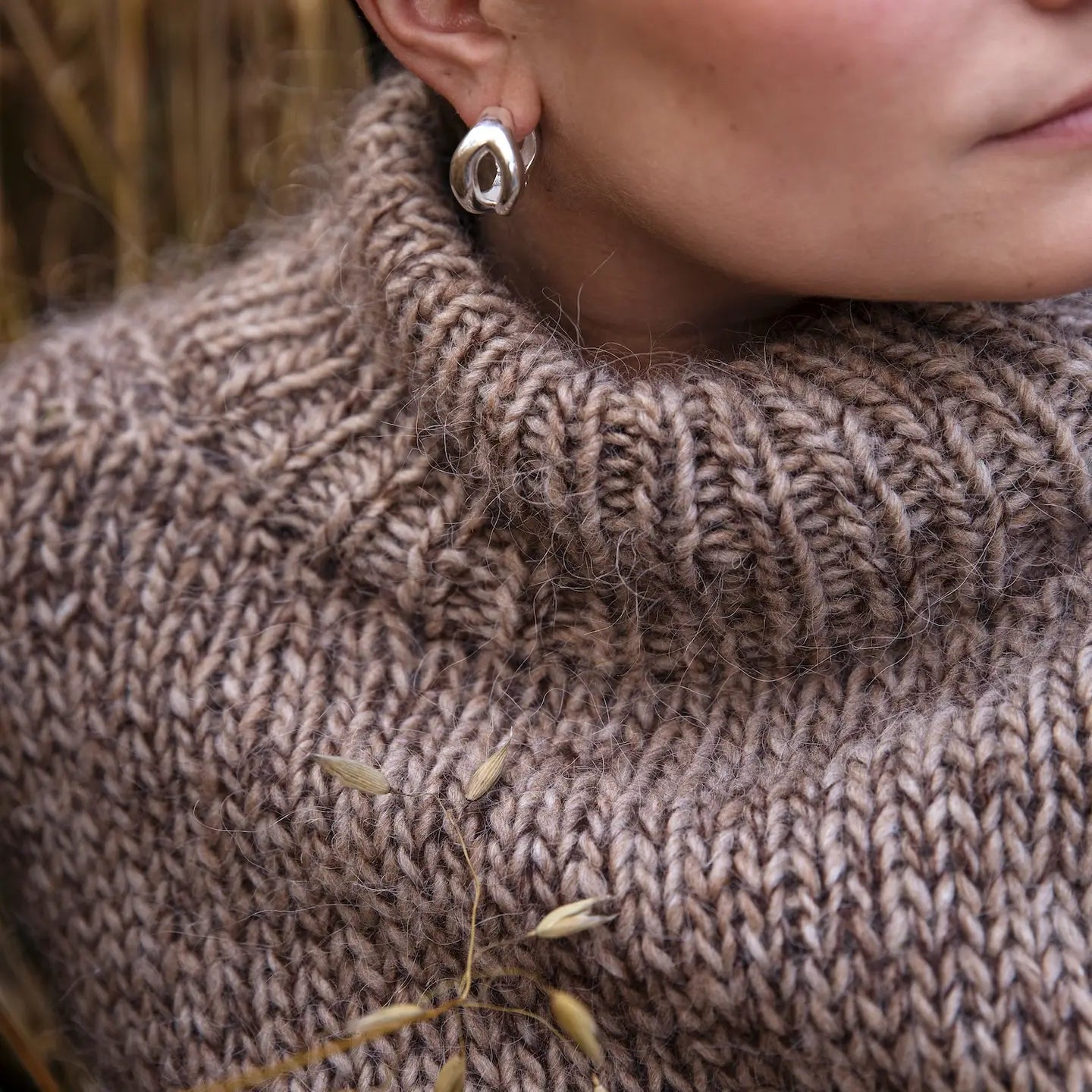 A brown knitted sweater with a turtleneck