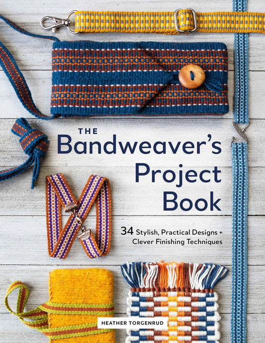 Book titled 'The Bandweaver's Project Book' with woven bands on a wooden surface.