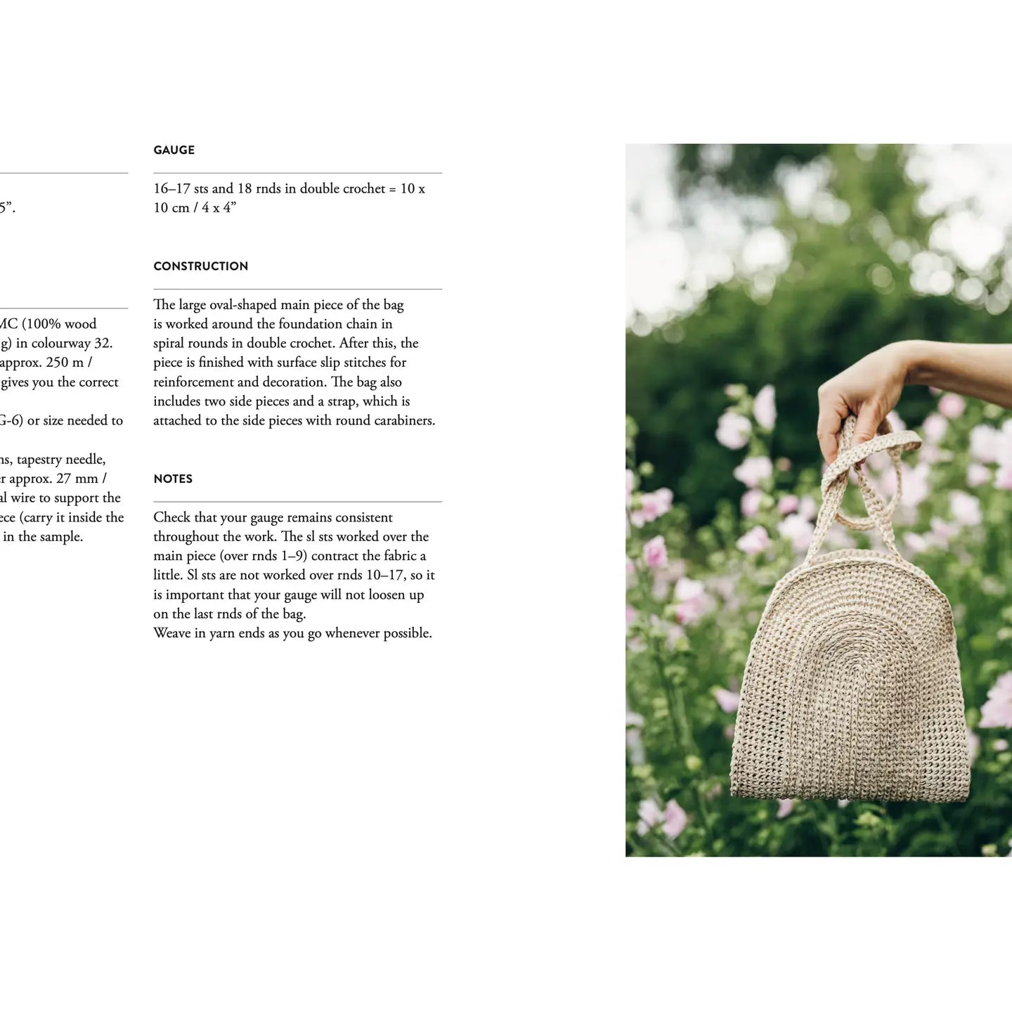 Woven handbag held by a hand with a blurred natural background