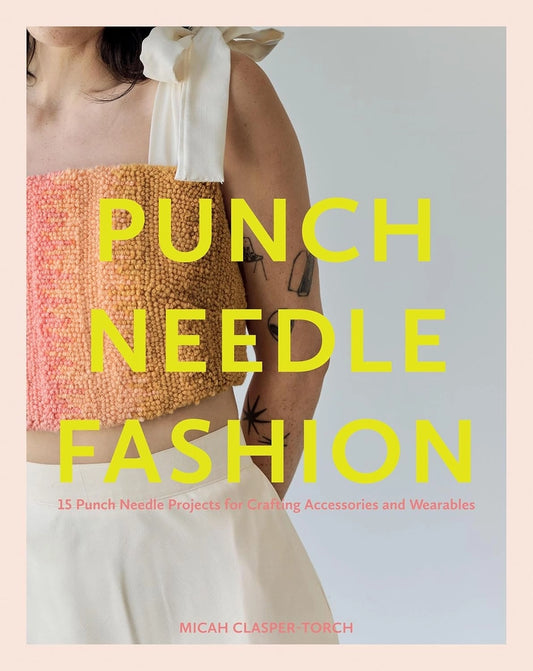 Book cover of 'Punch Needle Fashion' with a person wearing a colorful top against a light gray background.