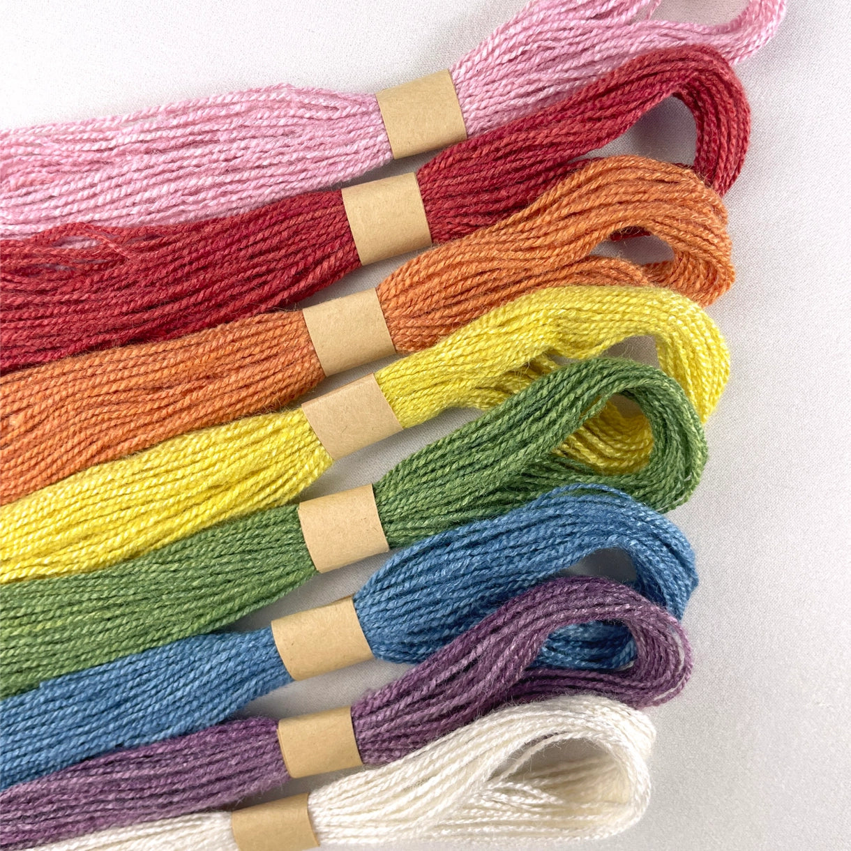 a closeup of rainbow dyed silk floss