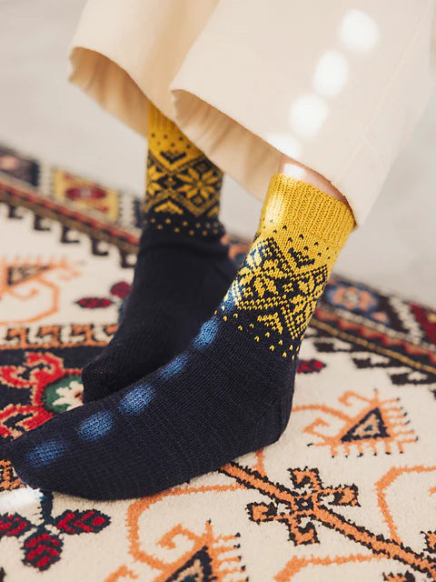 a pair of nav socks with yellow cuff details