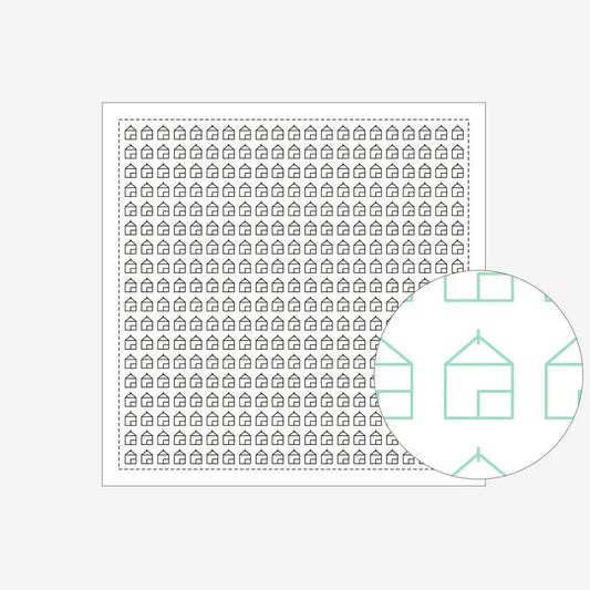 a sashiko design of triangular rood houses on a white cloth